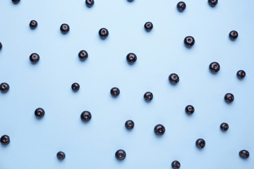 Fresh acai berries on color background