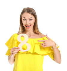 Beautiful young woman with figure 8 on white background. International Women's Day celebration