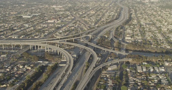 Aerial shot, day, high altitude view of busy large highway interchange, drone
