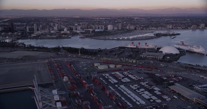 Aerial shot, low light, fly over los angeles shipping port to yaht docks and downtown Long Beach, drone