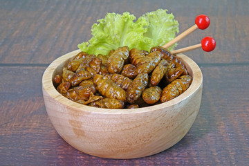 Edible insects : Deep fried crispy Silkworm pupae.  Entomophagy : Edible insects, other natural sources of nutrients. Famous street food in Thailand. Close up