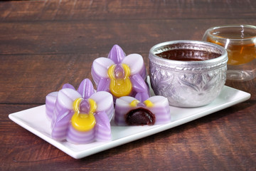 Thai dessert : Steamed layer sweet cake (or Khanom Chan) Thai traditional dessert in orchid flowers shaped, filling with red bean paste. One of nine famous Thai auspicious desserts in Thailand.