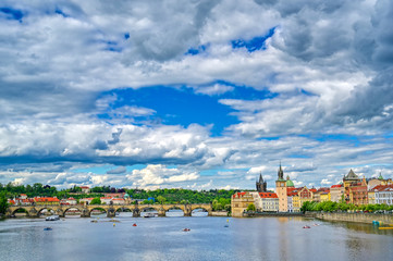 A view of Old Town Prague and the Charles Bridge across the Vltava River in Prague, Czech Republic.