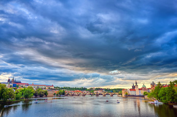 A view of Old Town Prague and the Charles Bridge across the Vltava River in Prague, Czech Republic.