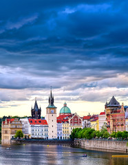 Obraz premium A view of Old Town Prague and the Charles Bridge across the Vltava River in Prague, Czech Republic.