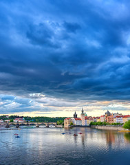 A view of Old Town Prague and the Charles Bridge across the Vltava River in Prague, Czech Republic.