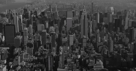 BLack and white aerial zoom up 6th avenue into Central Park, drone