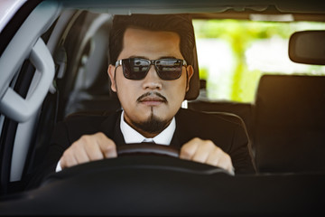 business man driving a car