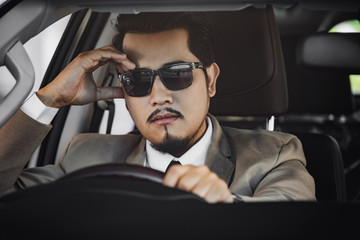 stressed business man driving a car