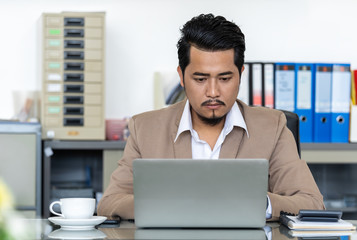 business man using laptop computer