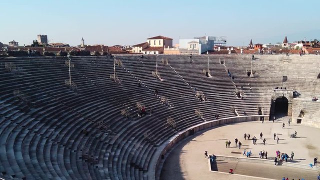 Panorama on classic ancient amphitheatre building in Verona downtown, Italy. Royalty free Full HD stock footage for projects related to Italian, European history, travel, culture, architecture.