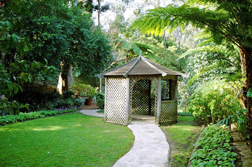 A pathway through a summerhouse and beyond.