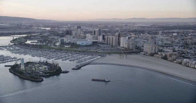 Aerial shot, low light, examination of yaht docks and downtown Long Beach, drone