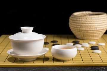 Fototapeta na wymiar Tea set on the chessboard