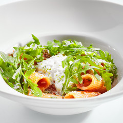 Rigatoni in tomato sauce and stracciatella cheese