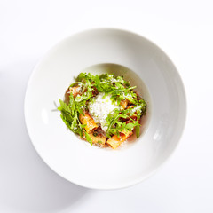 Rigatoni in tomato sauce and stracciatella cheese top view