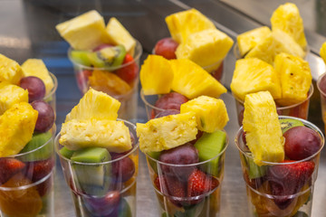 Close up photo of assorted fresh fruits at dessert store