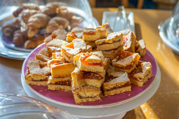 Delicious pieces of cake and jam in buffet party
