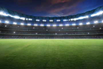 Stadium with spotlight and empty green grass. NIght scene . © jamesteoh.art