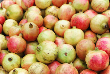 fresh pomegranate in pile as food background