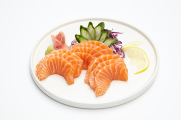 Salmon sashimi set in white plate on white background. Delicious Japanese sashimi set.