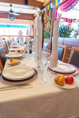 Vertical photo of beautiful banquet table setting with clean tableware