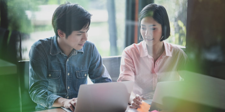 Team of UI web developer working on their project on smartphone templates