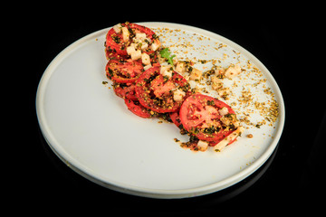 top view on sliced tomato modern decorated with assorted herbs