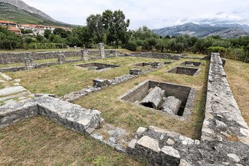 Bases of the ancient church with graves under the flooring