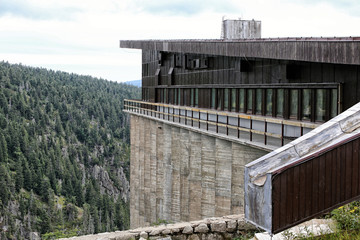 Fototapeta na wymiar Large mountain building with concrete bases