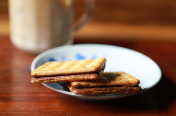 Chocolate cracker on dish for eating with coffee 