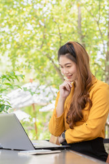 Business Asian young woman working with computer laptop and thinking to get ideas and requirement in Business startup feeling so happiness,Small Business Startup Concept