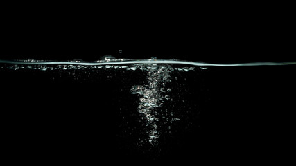 water splash isolated on dark black background