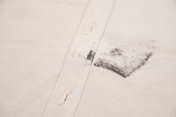 Dirty stain on cloth from food and sweat 