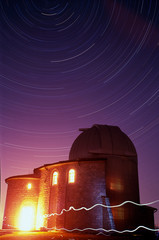 Star trails over an observatory