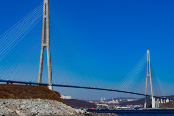 Fototapeta na wymiar Russian bridge against the blue sky.