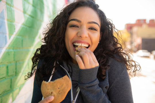 Woman eating cookie