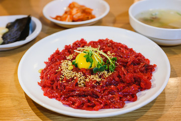 Korean food Yukhoe with kimchi and soup