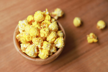 baked popcorn for eating in wooden bowl 