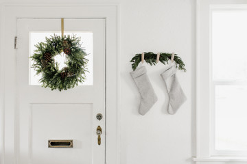 Minimalist Gray Christmas Stockings Hanging on Wooden Pegs