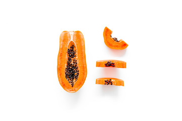 Sliced papaya on white background top view copy space