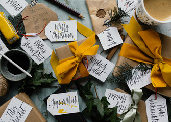 Making a list and writing tags for wrapped christmas presents