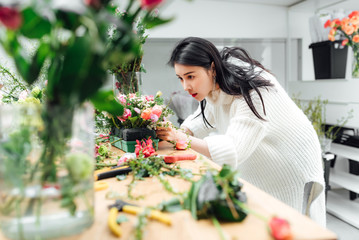 Young asian girls making flower arrangement