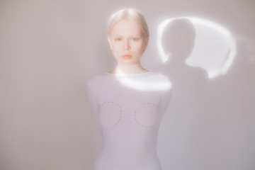 Young model standing in white room