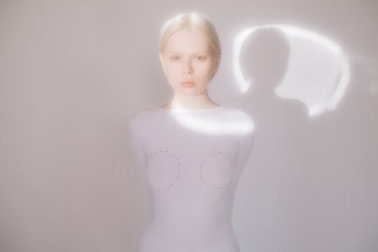 Young model standing in white room