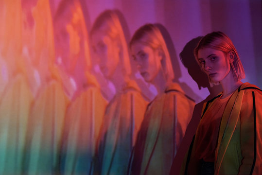 Recursion Of Young Woman In Neon Lights
