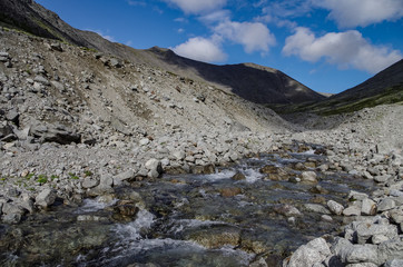 River in mountain valley in Khibiny range, mountains above the Arctic circle, Kola peninsula, Russia
