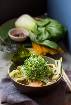 Miso broth with salmon, noodles and micro greens