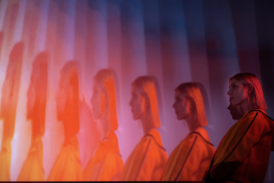 Contemporary Blond Model In Neon Recursion