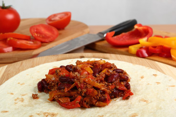 Making Burrito. Tortilla with meat, beans and bell pepper. Series. 